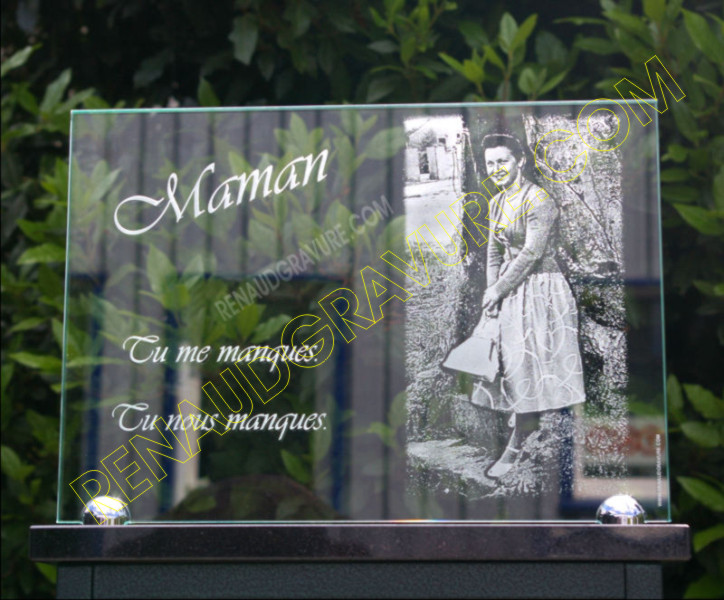 Engraver of glass burial plaques with engraved photo.